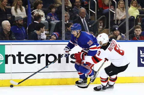 NEW YORK, NEW YORK – FEBRUARY 23: Chris Kreider #20 of the New York Rangers skates against Will Butcher #8 of the New Jersey Devils during their game at Madison Square Garden on February 23, 2019 in New York City. (Photo by Al Bello/Getty Images)