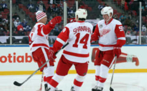 Dec 31, 2016; Toronto, ON, Canada; Detroit Red Wings forward Igor Larionov (8) celebrates his second period goal with forward Brendan Shanahan (14) and defenseman Larry Murphy (55) against the Toronto Maple Leafs during the 2017 Rogers NHL Centennial Classic Alumni Game at BMO Field. The Red Wings beat the Maple Leafs 4-3. Mandatory Credit: Tom Szczerbowski-USA TODAY Sports