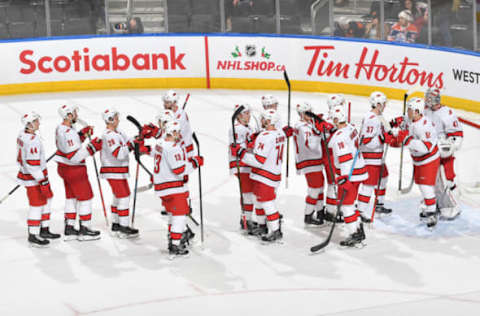 EDMONTON, AB – DECEMBER 10: Players of the Carolina Hurricanes celebrates after winning the game against the Edmonton Oilers on December 10, 2019, at Rogers Place in Edmonton, Alberta, Canada. (Photo by Andy Devlin/NHLI via Getty Images)