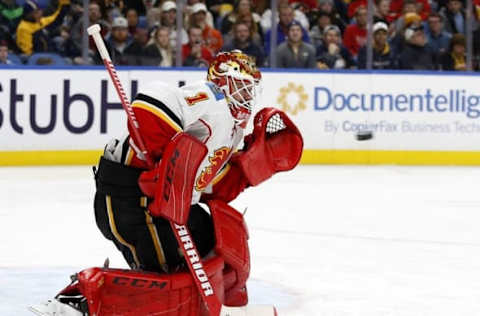 Nov 21, 2016; Buffalo, NY, USA; Calgary Flames goalie Brian Elliott (1) looks to make a glove save during the second period against the Buffalo Sabres at KeyBank Center. Mandatory Credit: Timothy T. Ludwig-USA TODAY Sports