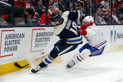 COLUMBUS, OH – NOVEMBER 19: Pierre-Luc Dubois #18 of the Columbus Blue Jackets and Brett Kulak #17 of the Montreal Canadiens battle for control of the puck during the second period on November 19, 2019 at Nationwide Arena in Columbus, Ohio. (Photo by Kirk Irwin/Getty Images)