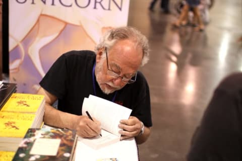 Peter S. Beagle autographs a copy of The Last Unicorn at Phoenix Comic Con in 2012.