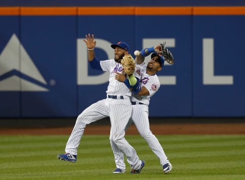 NEW YORK, NY – AUGUST 20: (NEW YORK DAILIES OUT) Amed Rosario #1 and Dominic Smith #22 of the New York Mets collide during the thirteenth inning against the San Francisco Giants at Citi Field on August 20, 2018 in the Flushing neighborhood of the Queens borough of New York City. The Giants defeated the Mets 2-1 after 13 innings. (Photo by Jim McIsaac/Getty Images)