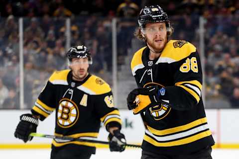 BOSTON, MASSACHUSETTS – DECEMBER 07: David Pastrnak #88 of the Boston Bruins and Brad Marchand #63 skate against the Colorado Avalanche during the third period at TD Garden on December 07, 2019 in Boston, Massachusetts. The Avalanche defeat the Bruins 4-1. (Photo by Maddie Meyer/Getty Images)