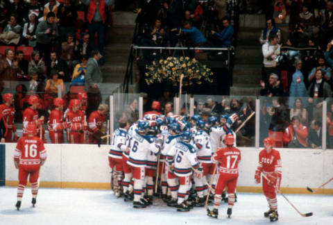 The United States Hockey team celebrates after they defeated the Soviet Union during a metal round game of the Winter Olympics February 22, 1980 at the Olympic Center in Lake Placid, New York.