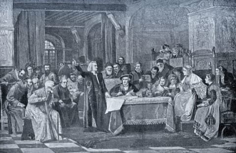 An illustration of Christopher Columbus at the court of Queen Isabella I and King Ferdinand II.