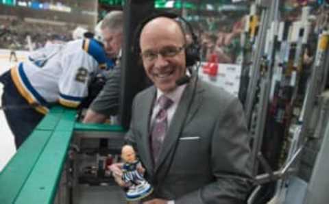 Mar 12, 2016; Dallas, TX, USA; St. Louis Blues color commentator and former goalie Darren Pang shows off his bobble head during the third period of the game against the Dallas Stars at the American Airlines Center. The Blues defeated the Stars 5-4 in overtime. Mandatory Credit: Jerome Miron-USA TODAY Sports