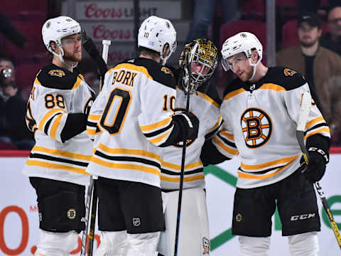 MONTREAL, QC – NOVEMBER 26: Goaltender Jaroslav Halak #41 of the Boston Bruins celebrates a victory with teammates David Pastrnak #88, Anders Bjork #10 and Matt Grzelcyk #48 against the Montreal Canadiens at the Bell Centre on November 26, 2019 in Montreal, Canada. The Boston Bruins defeated the Montreal Canadiens 8-1. (Photo by Minas Panagiotakis/Getty Images)