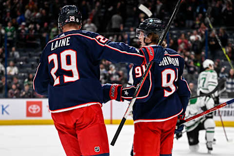 Dec 19, 2022; Columbus, Ohio, USA; Columbus Blue Jackets center Kent Johnson (91) celebrates a goal with left wing Patrik Laine (29) in the third period against the Dallas Stars at Nationwide Arena. Mandatory Credit: Gaelen Morse-USA TODAY Sports