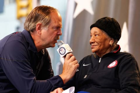 Sports broadcaster Jon Naber speaks to 1948 Olympic gold medalist Alice Coachman during the Team USA Road to London 100 Days Out Celebration in Times Square on April 18, 2012 in New York City.