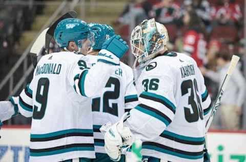 Dec 1, 2023; Newark, New Jersey, USA; San Jose Sharks goaltender Kaapo Kahkonen (36) celebrates with defenseman Jacob MacDonald (9) after defeating the New Jersey Devils at Prudential Center. Mandatory Credit: Vincent Carchietta-USA TODAY Sports