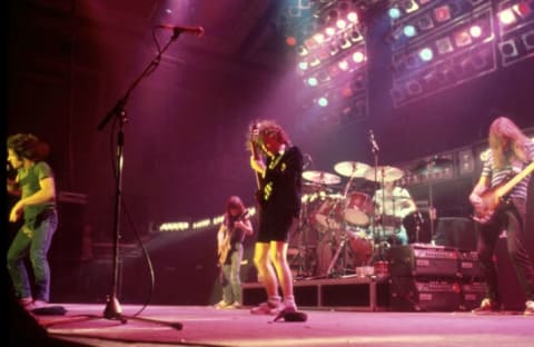 AC/DC's Brian Johnson, Malcolm Young, Angus Young, Phil Rudd, and Cliff Williams perform in London in 1980.