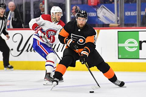 Feb 24, 2023; Philadelphia, Pennsylvania, USA; Philadelphia Flyers defenseman Ivan Provorov (9) carries the puck past Montreal Canadiens right wing Evgenii Dadonov (63) during the third period at Wells Fargo Center. Mandatory Credit: Eric Hartline-USA TODAY Sports