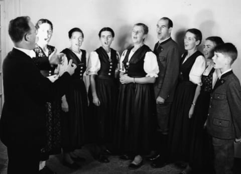 Father Franz Wasner conducts Maria von Trapp and her children in 1950.