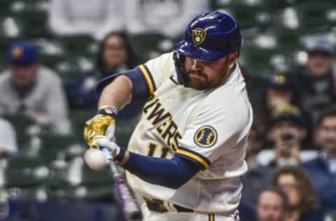 May 3, 2022; Milwaukee, Wisconsin, USA; Milwaukee Brewers first baseman Rowdy Tellez (11) hits a solo home run in the eighth inning against the Cincinnati Reds at American Family Field. Mandatory Credit: Benny Sieu-USA TODAY Sports