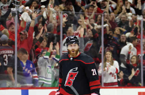 RALEIGH, NORTH CAROLINA – MAY 18: Ian Cole #28 of the Carolina Hurricanes scores at 3:12 of overtime against Igor Shesterkin #31 of the New York Rangers in Game One of the Second Round of the 2022 Stanley Cup Playoffs at PNC Arena on May 18, 2022, in Raleigh, North Carolina. The Hurricanes defeated the Rangers 2-1 in overtime. (Photo by Bruce Bennett/Getty Images)