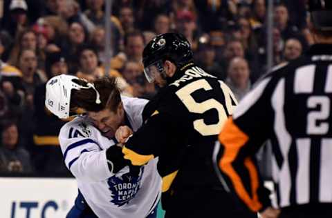 Feb 4, 2017; Boston, MA, USA; Boston Bruins defenseman Adam McQuaid (54) fights with Toronto Maple Leafs left wing Matt Martin (15) during the second period at TD Garden. Mandatory Credit: Bob DeChiara-USA TODAY Sports