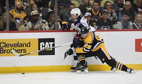 PITTSBURGH, PA – DECEMBER 06: Marcus Pettersson #28 of the Pittsburgh Penguins defends against Jack Roslovic #96 of the Columbus Blue Jackets in the second period during the game at PPG PAINTS Arena on December 6, 2022 in Pittsburgh, Pennsylvania. (Photo by Justin Berl/Getty Images)