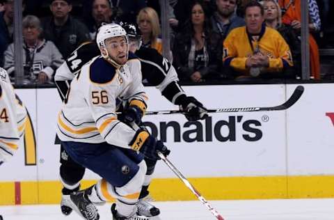 Feb 27, 2016; Los Angeles, CA, USA; Los Angeles Kings left wing Dwight King (74) chases down Buffalo Sabres right wing Justin Bailey (56) in the first period of the game at Staples Center. Mandatory Credit: Jayne Kamin-Oncea-USA TODAY Sports