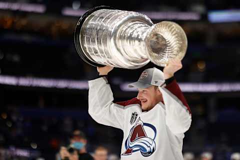 Jun 26, 2022; Tampa, Florida, USA; Colorado Avalanche defenseman Cale Makar (8) celebrates with the Stanley Cup after the Avalanche game against the Tampa Bay Lightning in game six of the 2022 Stanley Cup Final at Amalie Arena. Mandatory Credit: Geoff Burke-USA TODAY Sports