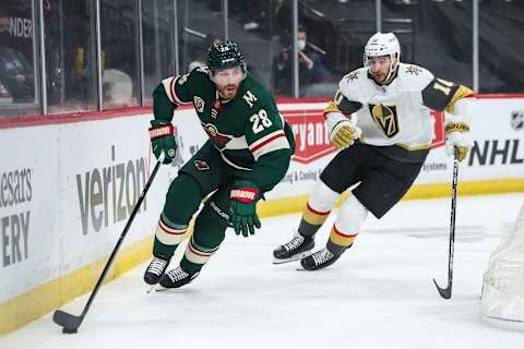 ST. PAUL, MN – MAY 22: Ian Cole #28 of the Minnesota Wild skates with the puck past Nicolas Roy #10 of the Vegas Golden Knights in the first period in Game Four of the First Round of the 2021 Stanley Cup Playoffs at Xcel Energy Center on May 22, 2021 in St Paul, Minnesota. The Golden Knights defeated the Wild 4-0. (Photo by David Berding/Getty Images)