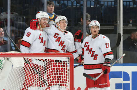 BUFFALO, NY – NOVEMBER 14: Dougie Hamilton #19 celebrates the game winning goal with Martin Necas #88 and Sebastian Aho #20 of the Carolina Hurricanes during an NHL game against the Buffalo Sabres on November 14, 2019 at KeyBank Center in Buffalo, New York. Carolina won 5-4 in overtime. (Photo by Joe Hrycych/NHLI via Getty Images)