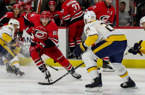 RALEIGH, NC – SEPTEMBER 27: Carolina Hurricanes left wing Teuvo Teravainen (86) looks to evade Nashville Predators defenseman Jarred Tinordi (24) as he enters the offensive zone with the puck during an NHL Pre-Season game between the Carolina Hurricanes and the Nashville Predators on September 27, 2019 at the PNC Arena in Raleigh, NC. (Photo by John McCreary/Icon Sportswire via Getty Images)