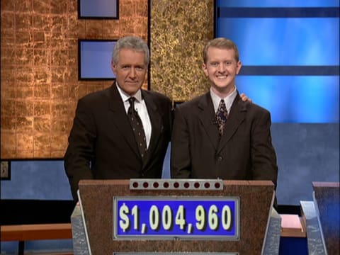 Jeopardy! host Alex Trebek poses with Ken Jennings after his record-breaking streak surpassed $1 million.