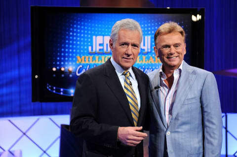 Alex Trebek and Pat Sajak pose on the set of the "Jeopardy!" Million Dollar Celebrity Invitational Tournament Show.