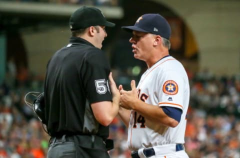 HOUSTON, TX – AUGUST 09: Umpire Nic Lentz (59) and Houston Astros manager AJ Hinch (14) argue after Houston Astros starting pitcher Justin Verlander (35) was ejected during the baseball game between the Seattle Mariners and Houston Astros on August 9, 2018 at Minute Maid Park in Houston, Texas. (Photo by Leslie Plaza Johnson/Icon Sportswire via Getty Images)