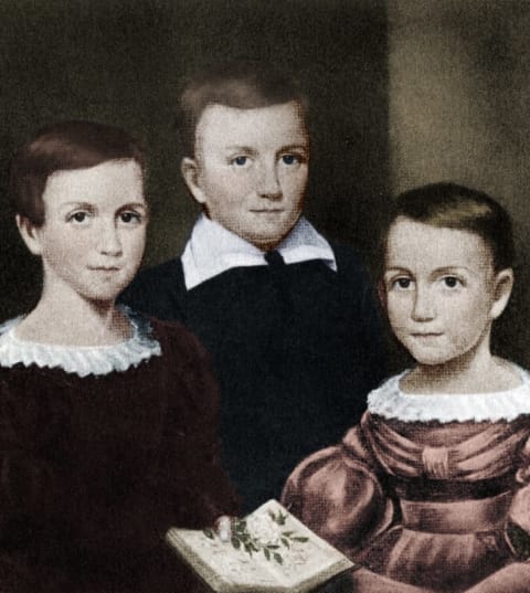 Left to right: Emily, Austin, and Lavinia Dickinson.