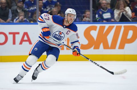 VANCOUVER, CANADA - OCTOBER 11: Connor McDavid #97 of the Edmonton Oilers skates up ice during the first period of their NHL game against the Vancouver Canucks at Rogers Arena on October 11, 2023 in Vancouver, British Columbia, Canada. (Photo by Derek Cain/Getty Images)