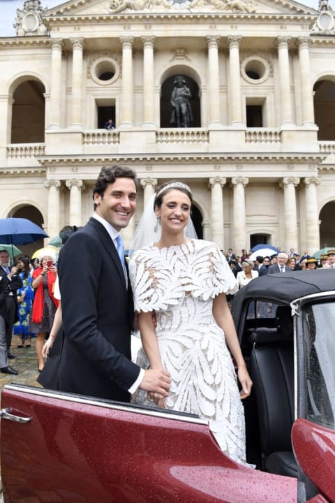 Jean-Christophe, Prince Napoléon and his wife, Olympia Von Arco-Zinneberg, on their wedding day, with a statue of Napoleon fittingly watching over them.