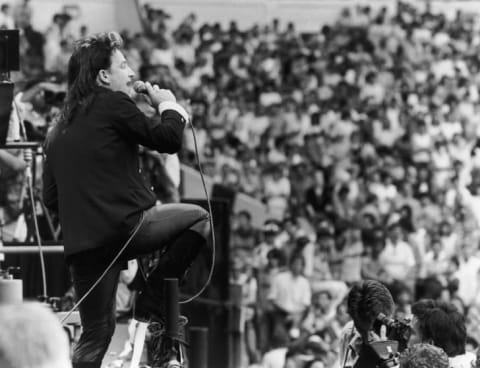 Bono performing with U2 at the Live Aid charity concert in London in 1985.