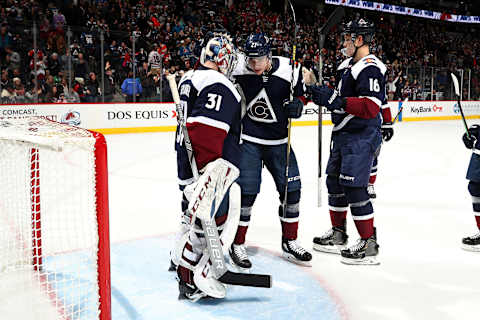 DENVER, COLORADO – NOVEMBER 30: Ryan Graves #27 of the Colorado Avalanche congratulates teammate goaltender Philipp Grubauer #31 after a win against the Chicago Blackhawks at Pepsi Center on November 30, 2019 in Denver, Colorado. The Avalanche defeated the Blackhawks 7-3. (Photo by Michael Martin/NHLI via Getty Images)