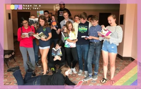 Students in Kansas check out the contents of their book box.