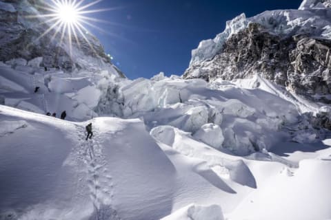 Climbers ascend the Khumbu Icefall, a notoriously dangerous section of the summit route.