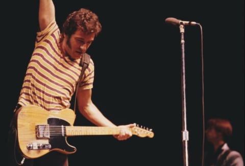 Bruce Springsteen performs on stage.