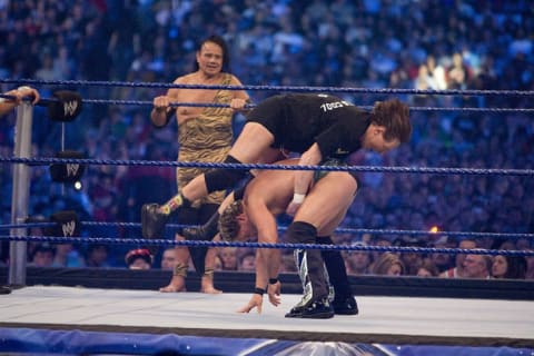 Jimmy "Superfly" Snuka look on as "Rowdy" Roddy Piper battles WWE Superstar Chris Jericho during WrestleMania 25 in 2009.