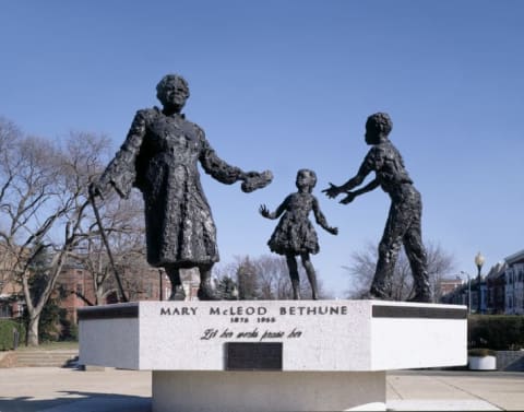 Mary McLeod Bethune depicted with a couple young students in Lincoln Park.