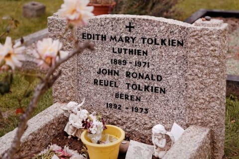 The burial site of Edith and J.R.R. Tolkien, with "Luthien" and "Beren" inscribed on the headstone.