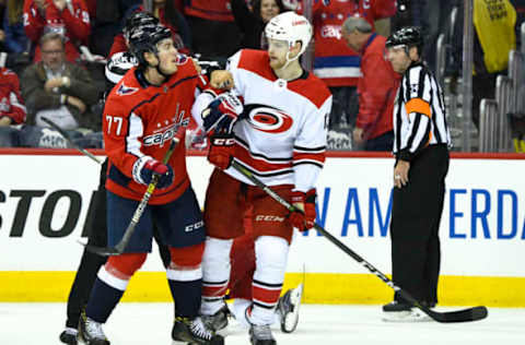 WASHINGTON, DC – APRIL 11: Washington Capitals right wing T.J. Oshie (77) and Carolina Hurricanes left wing Warren Foegele (13) have words in the second period on April 11, 2019, at the Capital One Arena in Washington, D.C. in the first round of the Stanley Cup Playoffs. (Photo by Mark Goldman/Icon Sportswire via Getty Images)