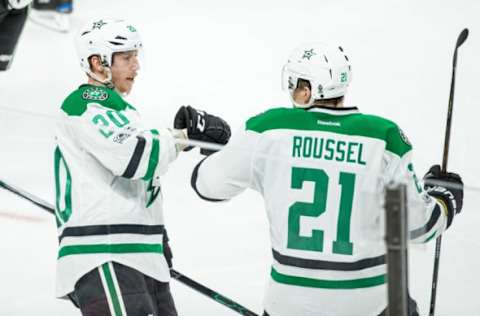 Feb 16, 2017; Saint Paul, MN, USA; Dallas Stars forward Cody Eakin (20) celebrates his goal with forward Antoine Roussel (21) during the third period at Xcel Energy Center. The Wild defeated the Stars 3-1. Mandatory Credit: Brace Hemmelgarn-USA TODAY Sports