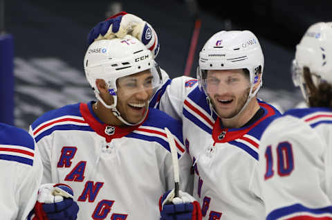 K’Andre Miller #79 of the New York Rangers (L) celebrates his third period goal against the New York Islanders and is joined by Jacob Trouba #8 (R) . (Photo by Bruce Bennett/Getty Images)