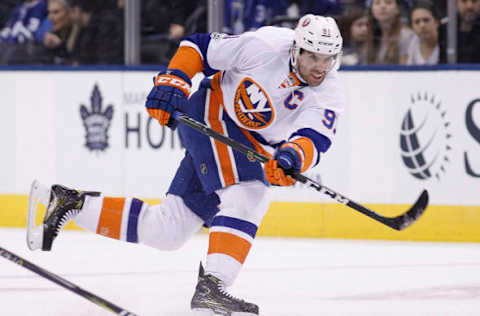 Feb 14, 2017; Toronto, Ontario, CAN; New York Islanders forward John Tavares (91) shoots the puck against the Toronto Maple Leafs during the first period at the Air Canada Centre. Mandatory Credit: John E. Sokolowski-USA TODAY Sports