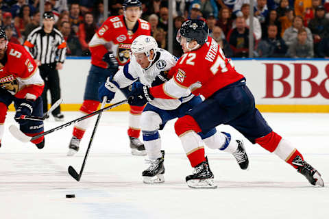 SUNRISE, FL – FEBRUARY 10: Yanni Gourde #37 of the Tampa Bay Lightning crosses sticks with Frank Vatrano #72 of the Florida Panthers at the BB&T Center on February 10, 2019 in Sunrise, Florida. (Photo by Eliot J. Schechter/NHLI via Getty Images)