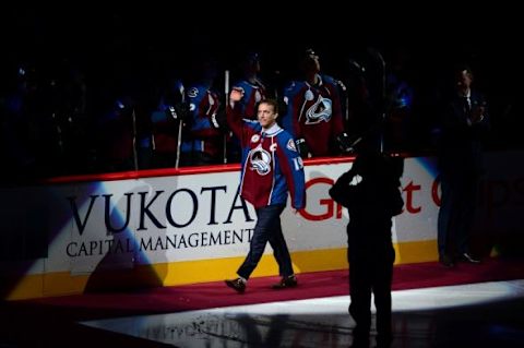 Dec 7, 2015; Denver, CO, USA; Colorado Avalanche general manager Joe Sakic fans waves to the crowd before the game against the Minnesota Wild at Pepsi Center. Mandatory Credit: Ron Chenoy-USA TODAY Sports