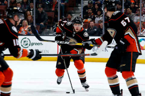 ANAHEIM, CA – MARCH 14: Hampus Lindholm #47 of the Anaheim Ducks controls the puck with help from Corey Perry #10 and Rickard Rakell #67 during the game against the Vancouver Canucks. (Photo by Debora Robinson/NHLI via Getty Images)