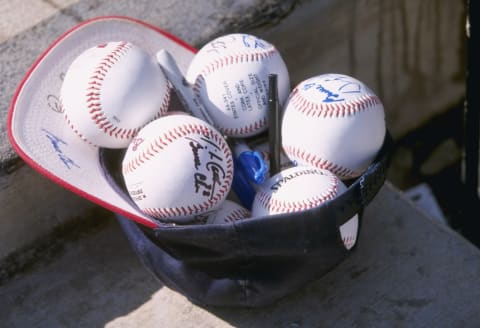 27 Feb 1998: A general view of autographed balls in an Atlanta Braves baseball cap during a Spring Training game against the Kansas City Royals at the Disney Wide World of Sports Stadium in Orlando, Florida. The Royals defeated the Braves 3-2. Mandatory