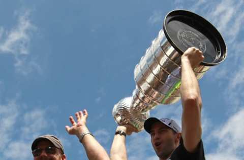 BOSTON – JUNE 18: Boston Bruins goalie Tim Thomas and Boston Bruins defenseman Zdeno Chara head out with the Stanley Cup from the TD Garden as throngs of fans who gathered to watch, cheered them on. (Photo by Barry Chin/The Boston Globe via Getty Images)